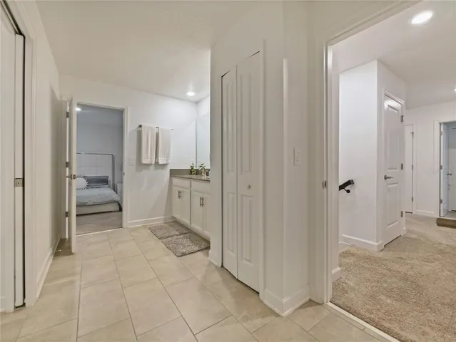 a bathroom with a double vanity sink toilet and shower