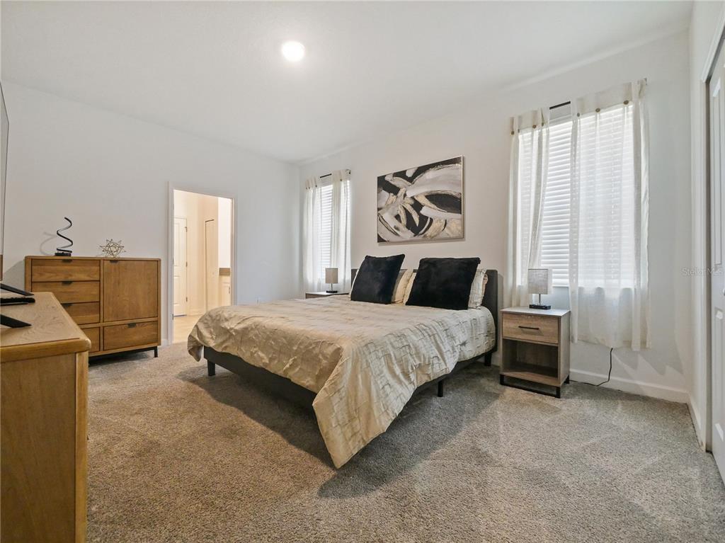 9084 Sommerset Hills Drive Davenport, FL 33896 - Photo 56 of 63 a bedroom with a bed and window