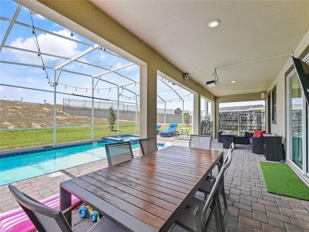 9084 Sommerset Hills Drive Davenport, FL 33896 - Photo 60 of 63 a living room with furniture and a wooden floor