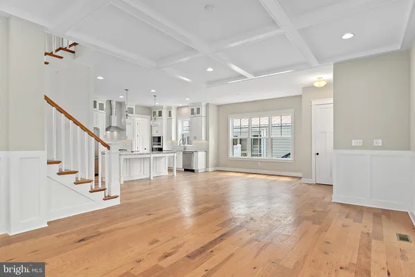a view of an entryway with wooden floor and windows