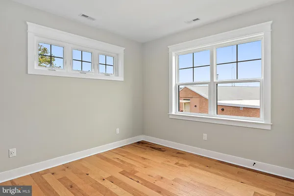 a bathroom with double sink and a mirror