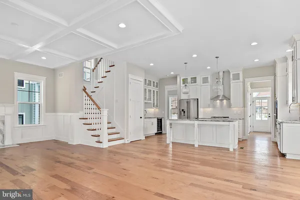 a view of kitchen with cabinets and wooden floor