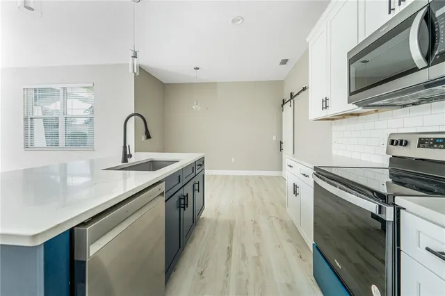 a white bath tub sitting in a bathroom and shower