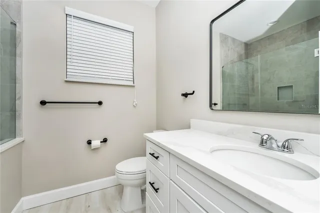 a view of an empty room with a window