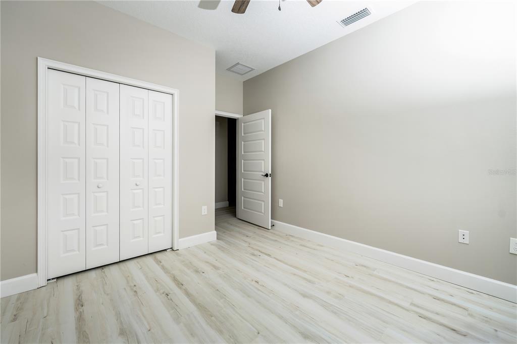 1011 Johnston Road Southeast Palm Bay, FL 32909 - Photo 32 of 47 a view of an empty room with wooden floor