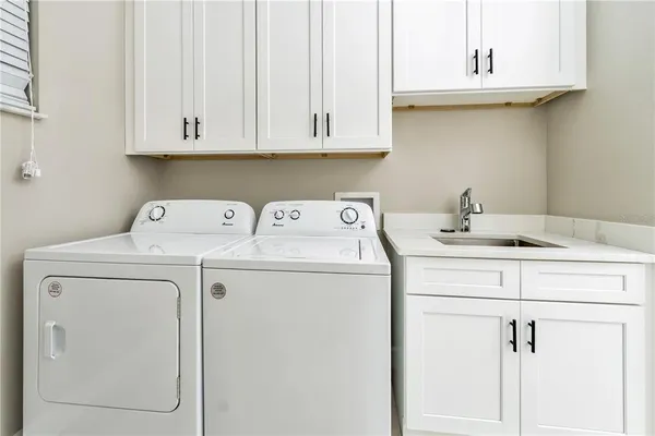 a utility room with dryer and washer