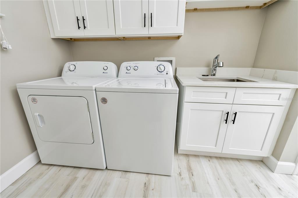 1011 Johnston Road Southeast Palm Bay, FL 32909 - Photo 40 of 47 a utility room with dryer and washer