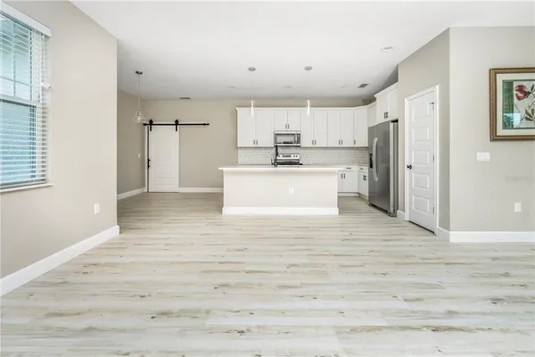 a view of kitchen with wooden floor