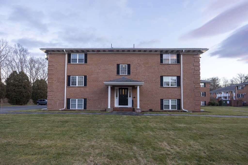 11 Leonard Road, Unit 11 Boxborough, MA 01719 - Photo 1 of 1 front view of house with a yard