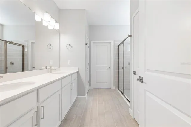 a view of a room with wooden floor and windows