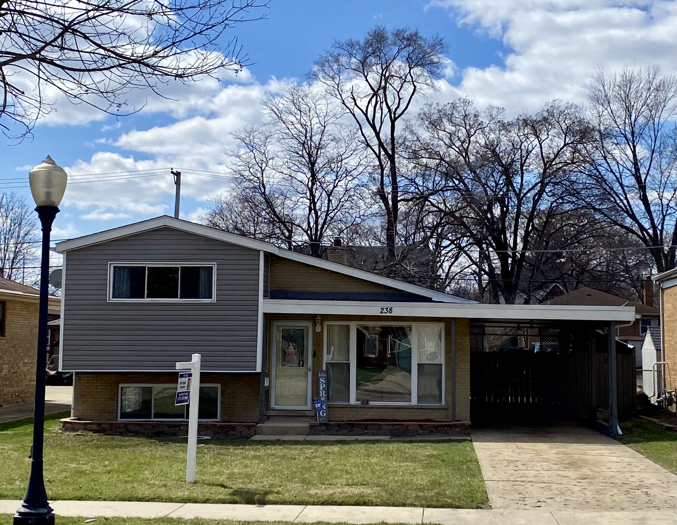 238 North Wolf Road Hillside, IL 60162 - Photo 1 of 17 a front view of a house with a yard