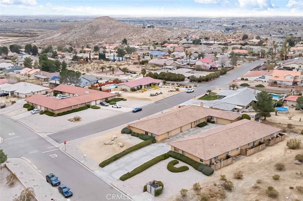 16340 Wato Road Apple Valley, CA 92307 - Photo 1 of 1 an aerial view of residential houses with outdoor space