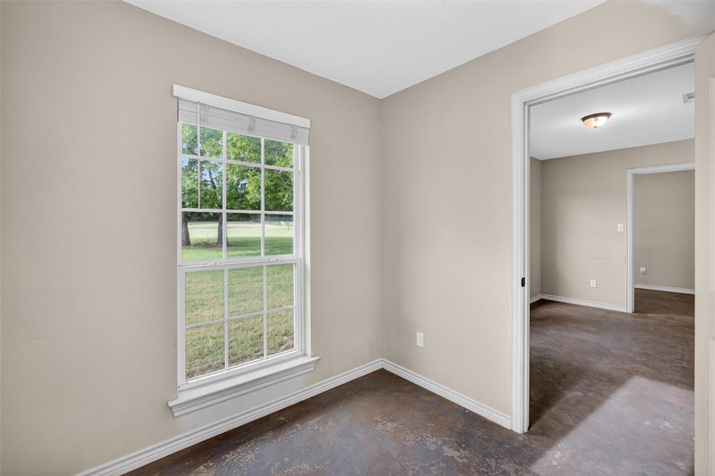 505 East 5th Street Springtown, TX 76082 - Photo 30 of 39 an empty room with windows and closet