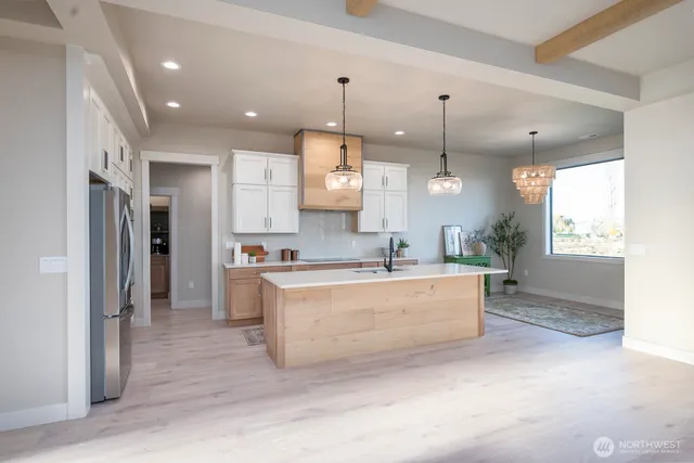 a kitchen with stainless steel appliances granite countertop a sink and a granite counter tops