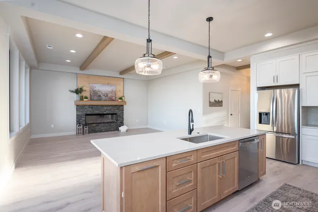 a kitchen with a sink and cabinets