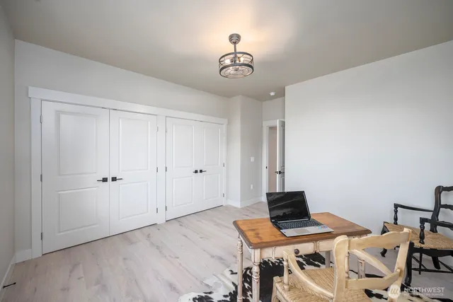 a view of house with garden space and balcony
