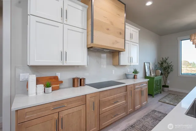 a kitchen with stainless steel appliances a refrigerator sink and microwave