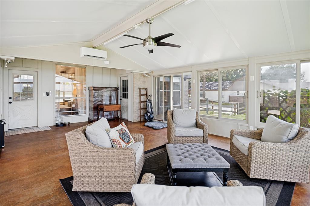 5643 West Caylor Road Fort Worth, TX 76244 - Photo 28 of 37 Heated/AC Spacious sunroom featuring a vaulted ceiling, multiple large windows, a ceiling fan, and concrete flooring