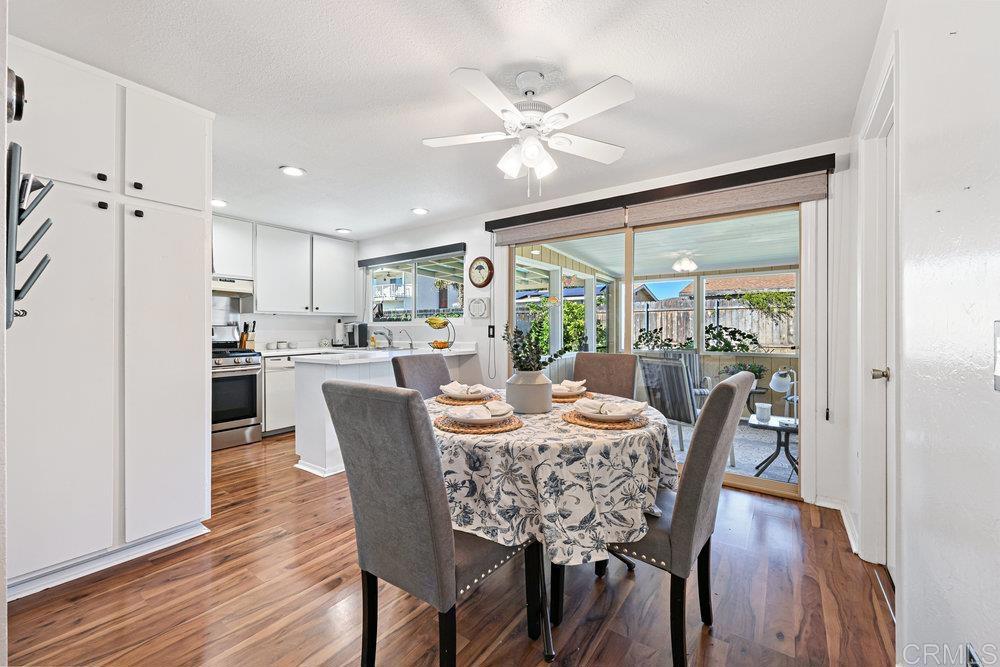 8450 Carlton Oaks Drive Santee, CA 92071 - Photo 12 of 30 a dining room with furniture window and wooden floor