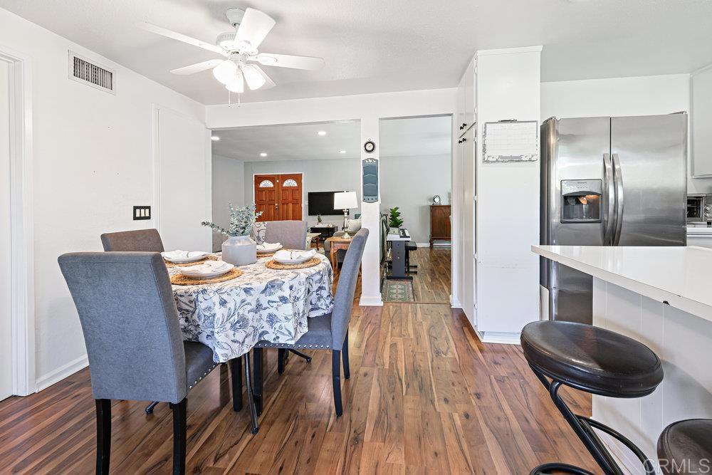 8450 Carlton Oaks Drive Santee, CA 92071 - Photo 15 of 30 a dining room with furniture and wooden floor