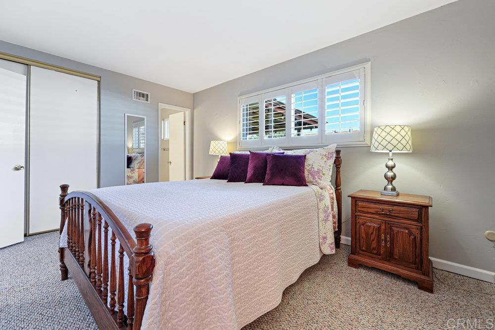 8450 Carlton Oaks Drive Santee, CA 92071 - Photo 18 of 30 a bedroom with a bed and a window