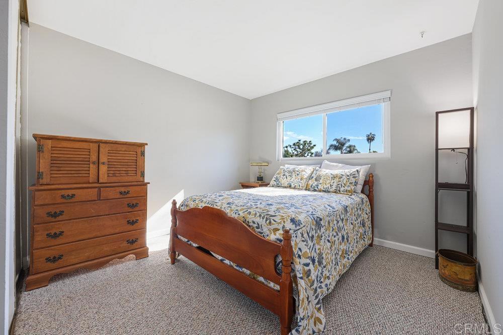 8450 Carlton Oaks Drive Santee, CA 92071 - Photo 20 of 30 a bedroom with a bed and a closet