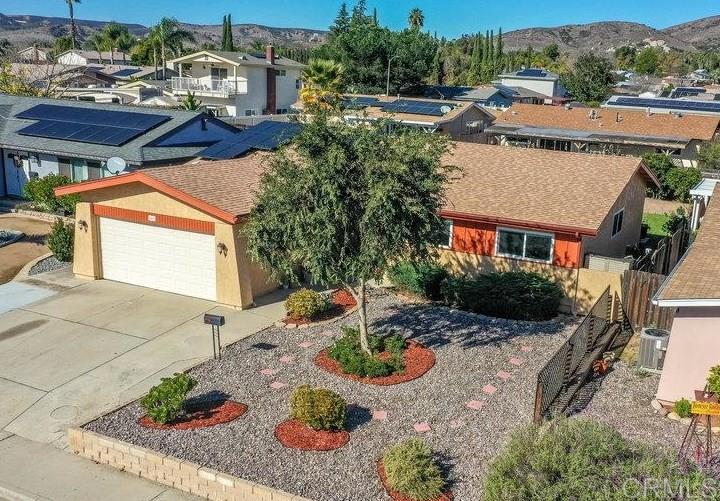 8450 Carlton Oaks Drive Santee, CA 92071 - Photo 2 of 30 a view of a patio with table and chairs potted plants