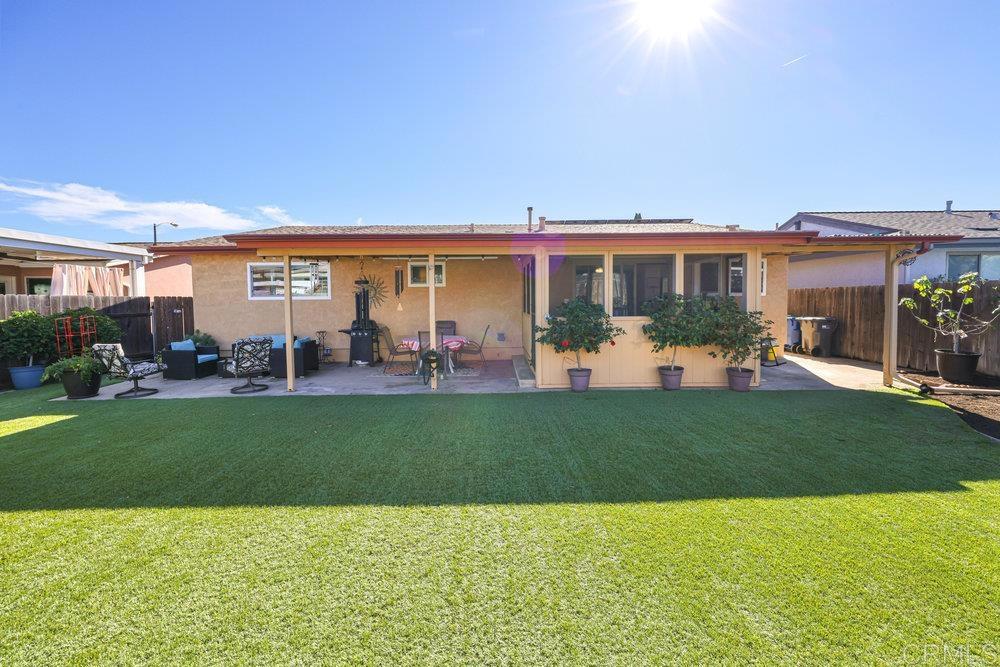 8450 Carlton Oaks Drive Santee, CA 92071 - Photo 3 of 30 a view of a house with a backyard