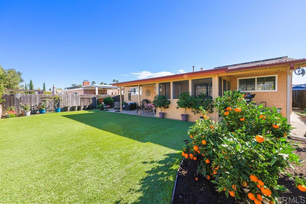 8450 Carlton Oaks Drive Santee, CA 92071 - Photo 5 of 30 a view of a house with a garden