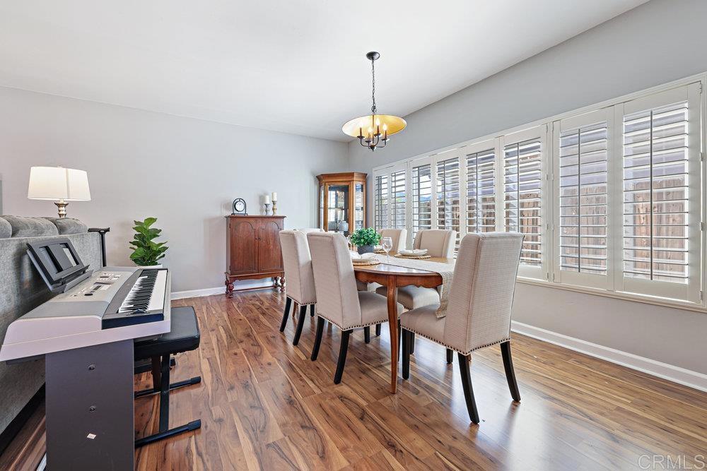 8450 Carlton Oaks Drive Santee, CA 92071 - Photo 9 of 30 a view of a dining room with furniture window and wooden floor