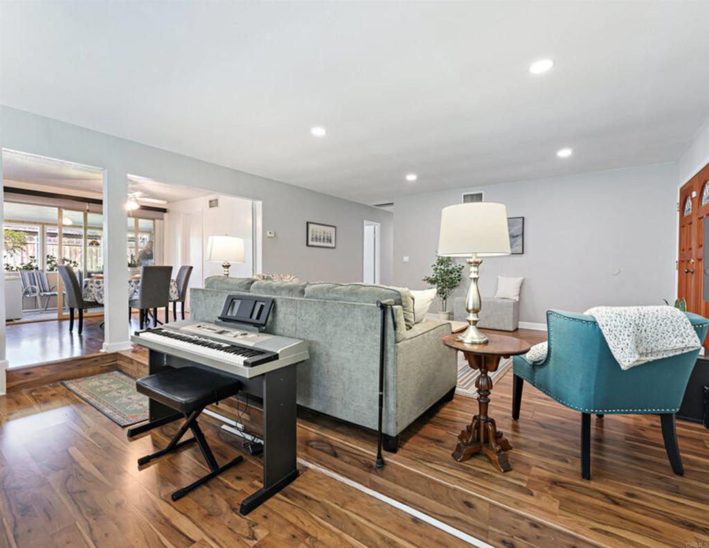 8450 Carlton Oaks Drive Santee, CA 92071 - Photo 10 of 30 a living room with furniture a wooden floor and a table