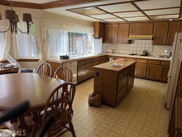 22244 Craft Calabasas, CA 91302 - Photo 7 of 8 a kitchen with stainless steel appliances granite countertop a sink a stove and a refrigerator