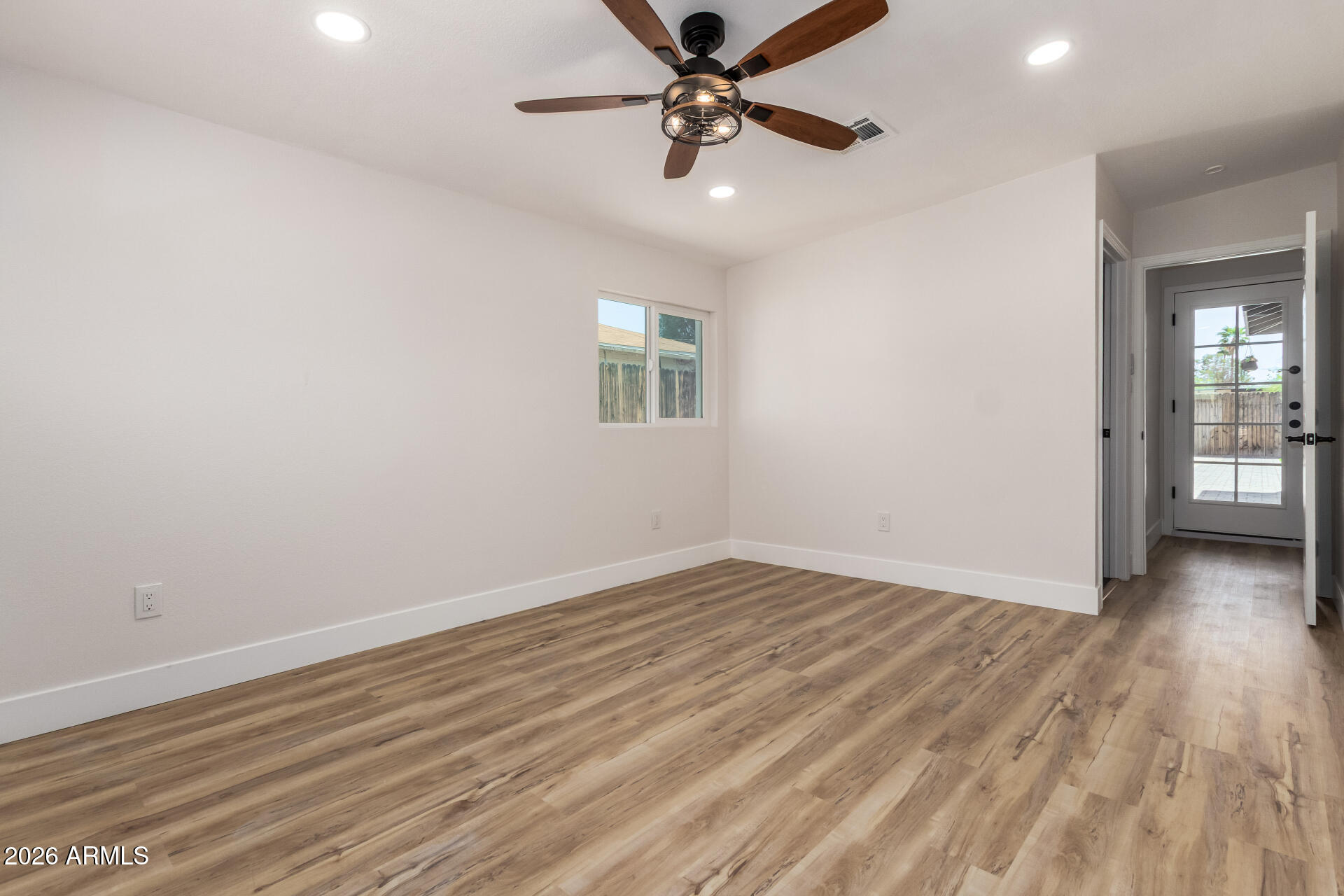 3111 North 34th Street Phoenix, AZ 85018 - Photo 27 of 76 wooden floor in an empty room with a window