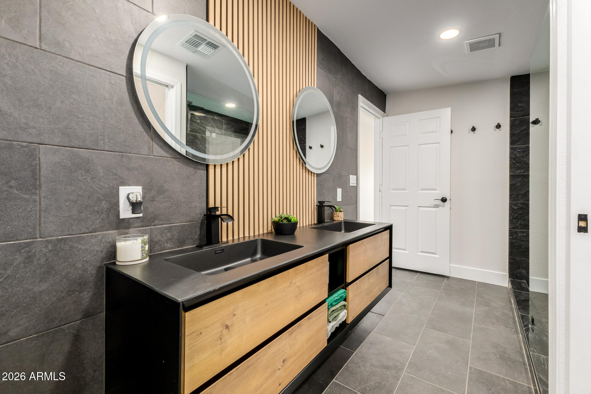 3111 North 34th Street Phoenix, AZ 85018 - Photo 39 of 76 a bathroom with a sink and a mirror
