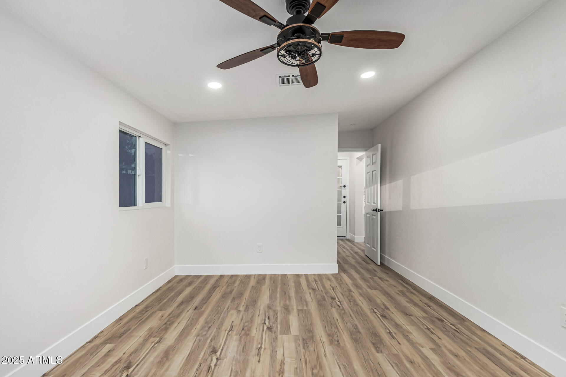 3111 North 34th Street Phoenix, AZ 85018 - Photo 60 of 76 wooden floor in an empty room with a window