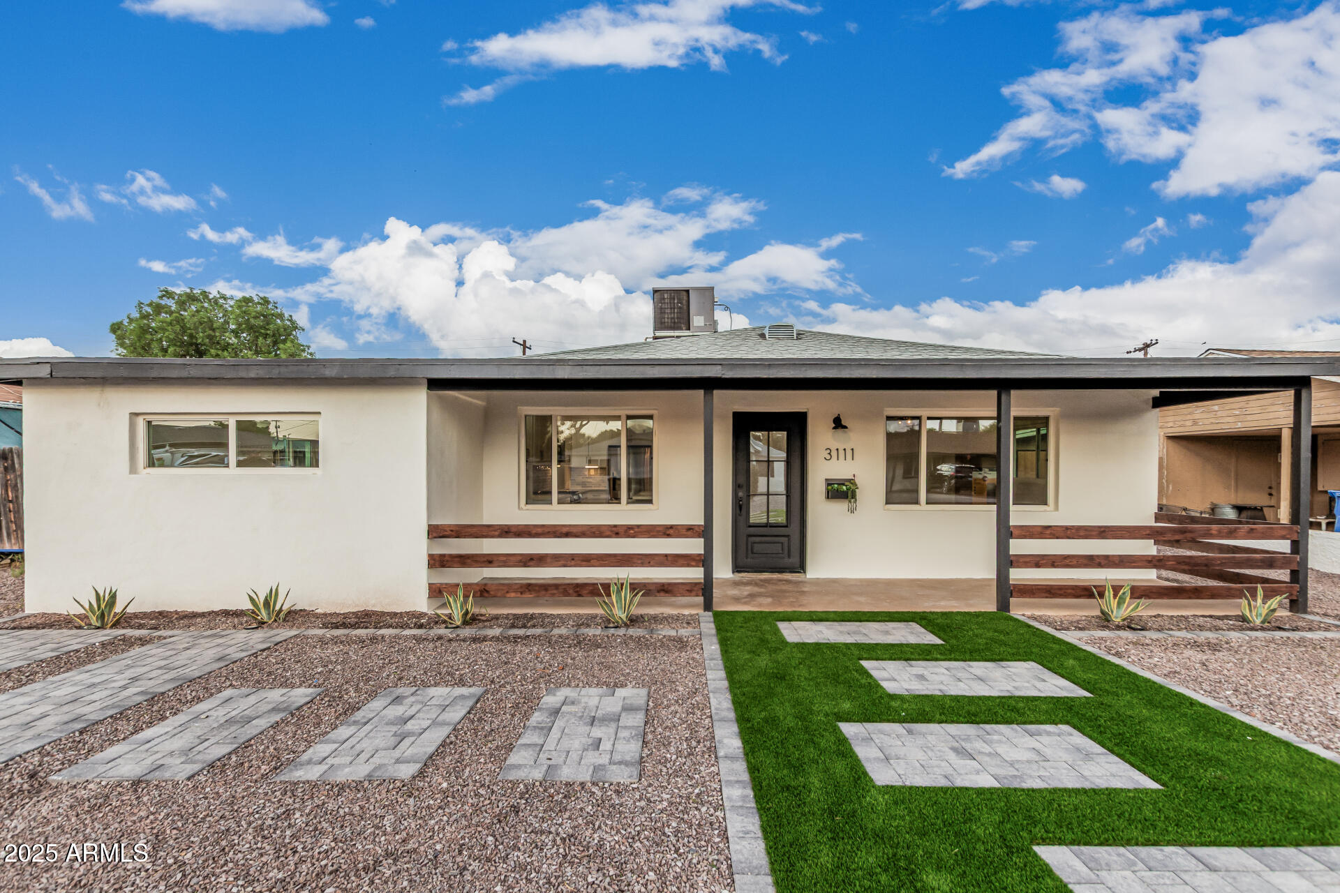 3111 North 34th Street Phoenix, AZ 85018 - Photo 65 of 76 a front view of a house with garden
