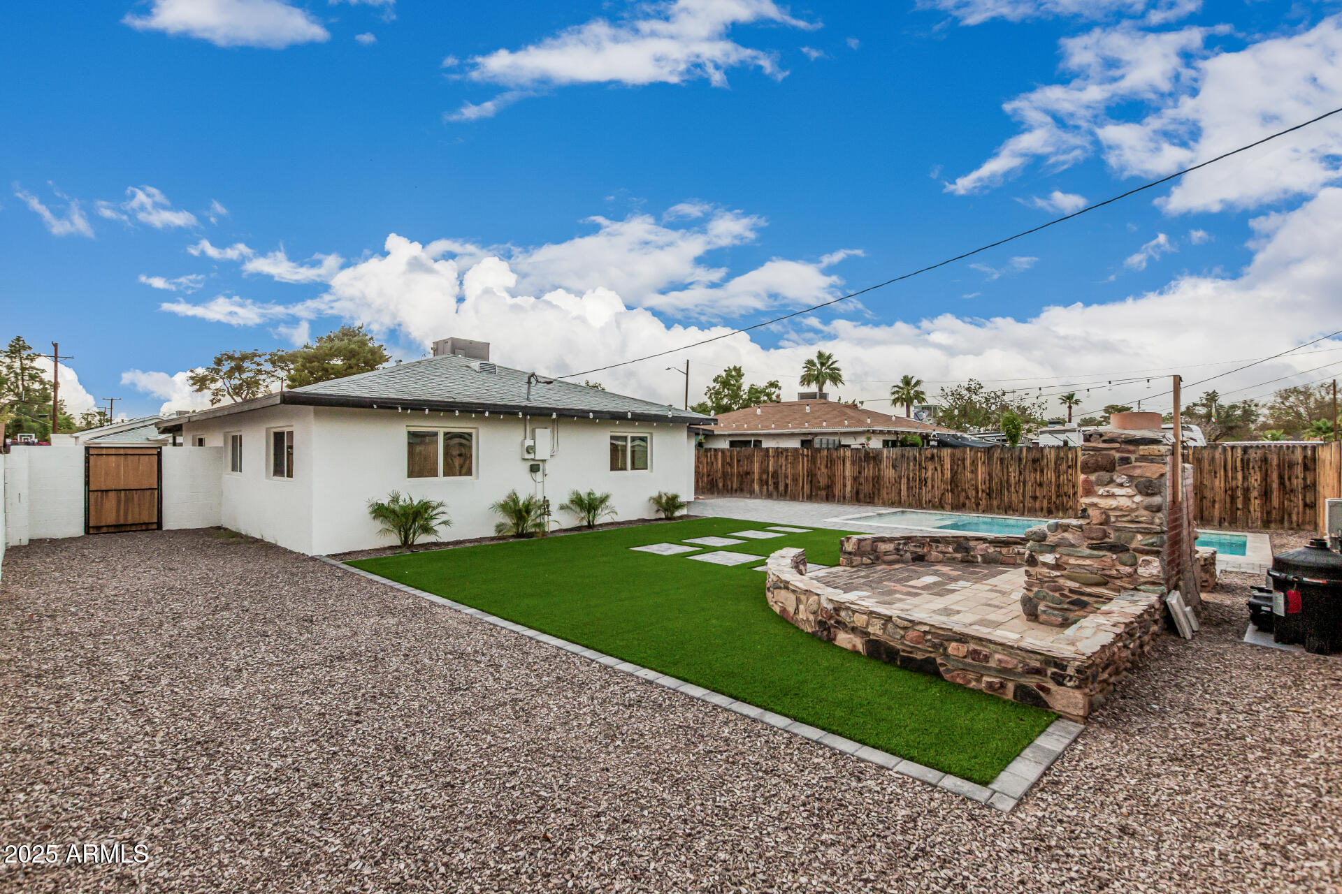 3111 North 34th Street Phoenix, AZ 85018 - Photo 69 of 76 a view of a house with backyard and porch