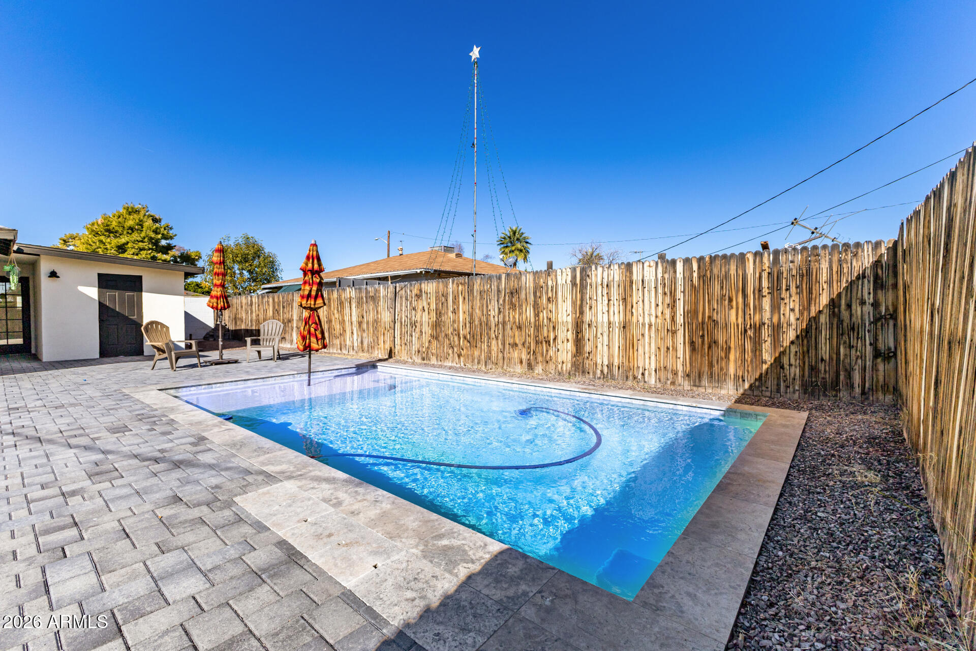 3111 North 34th Street Phoenix, AZ 85018 - Photo 75 of 76 a view of a swimming pool with an outdoor space and seating area