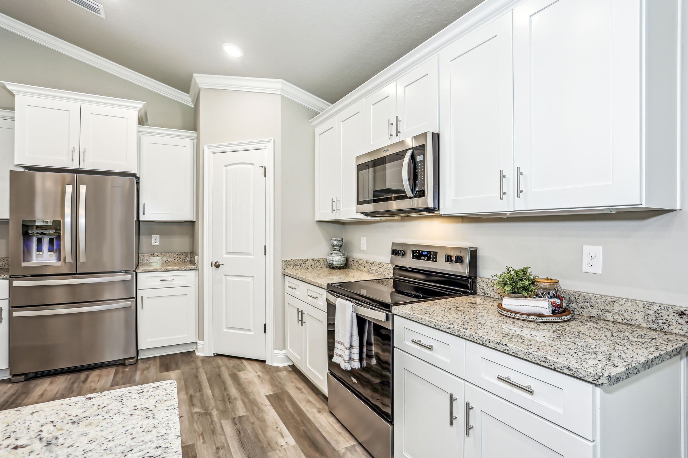 3494 Doyle Hawkins Road Navarre, FL 32566 - Photo 15 of 31 a kitchen with stainless steel appliances granite countertop a refrigerator sink and stove