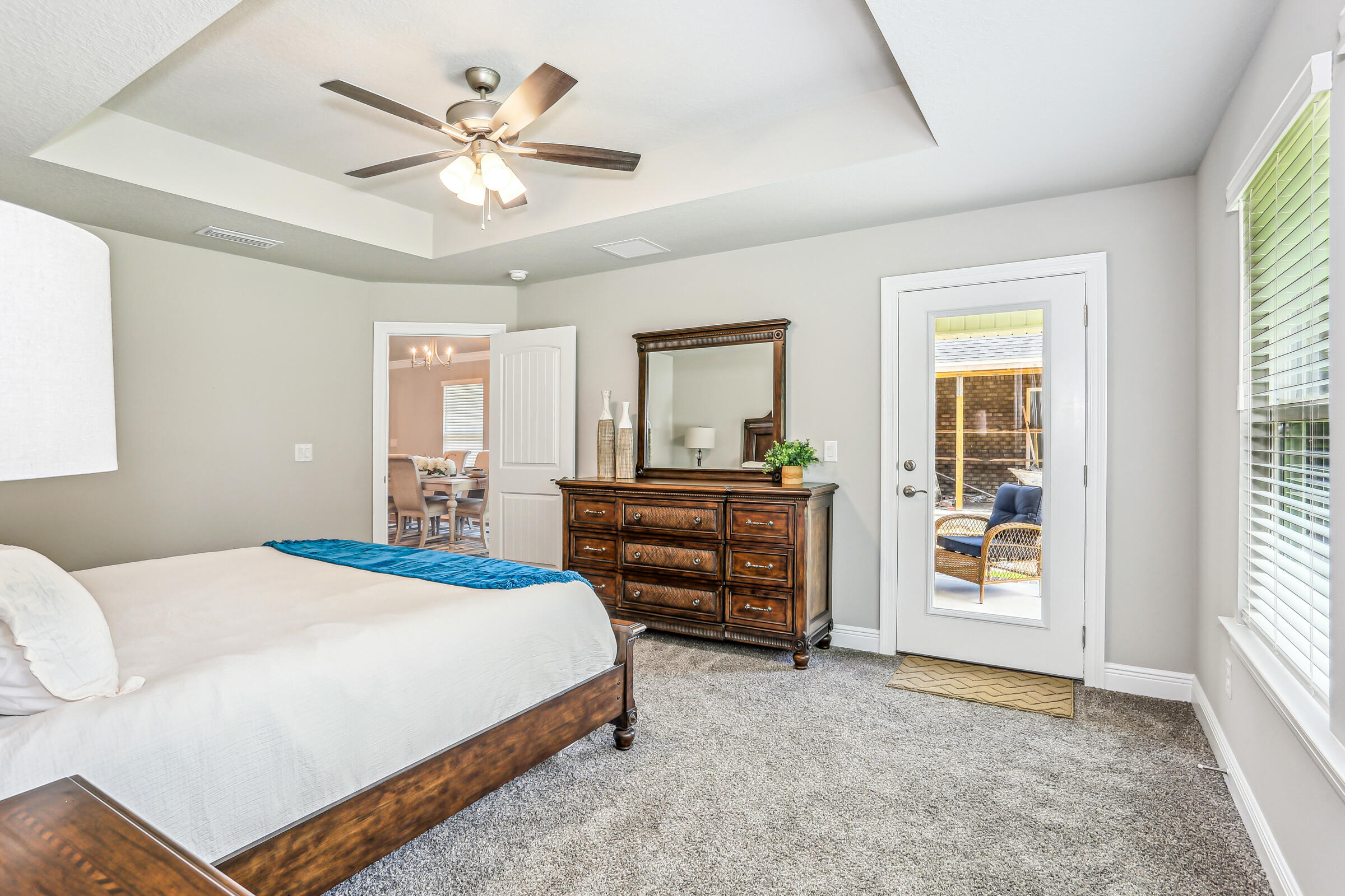 3494 Doyle Hawkins Road Navarre, FL 32566 - Photo 19 of 31 a bedroom with a bed and a large window