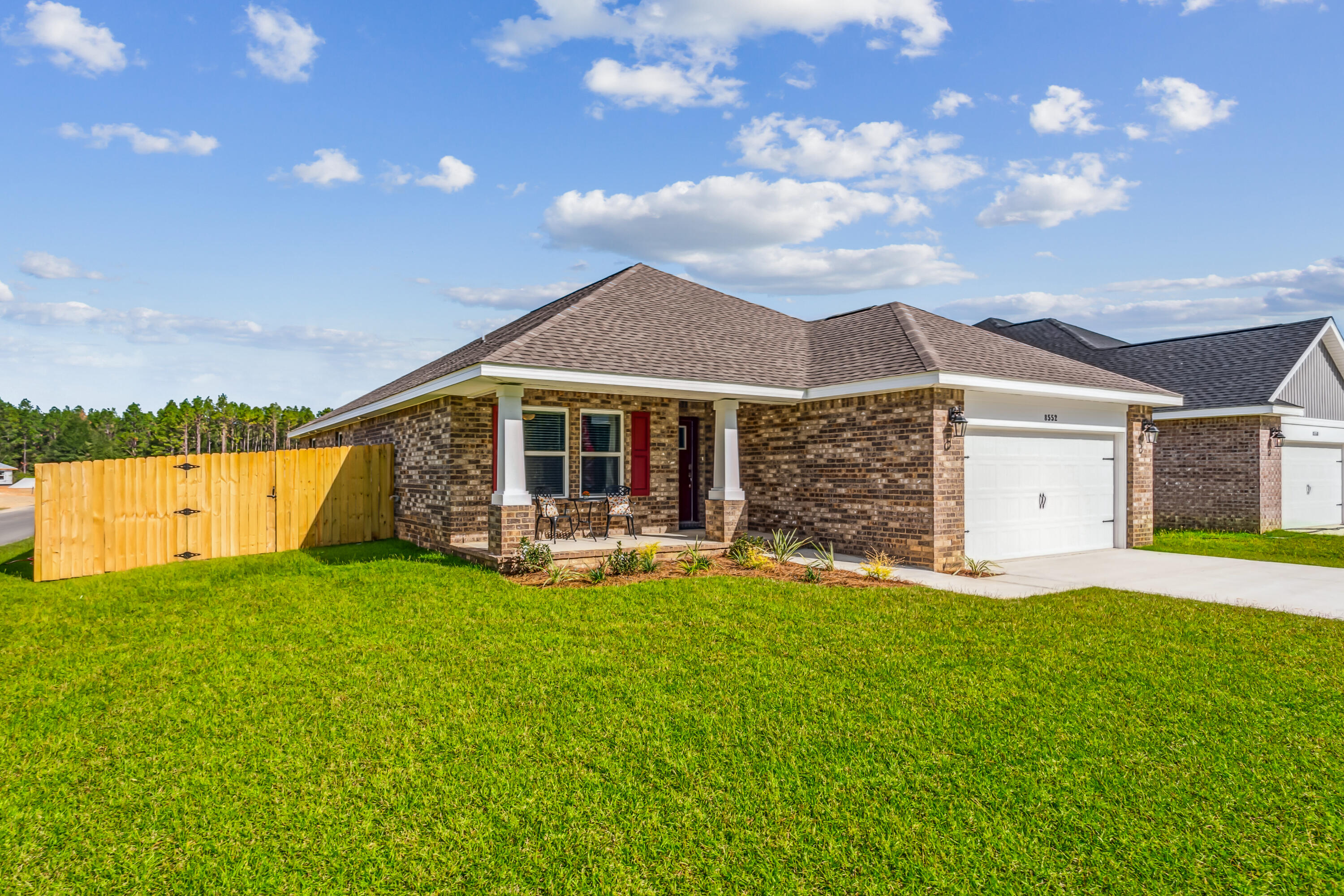3494 Doyle Hawkins Road Navarre, FL 32566 - Photo 5 of 31 a view of a house with a yard and sitting area