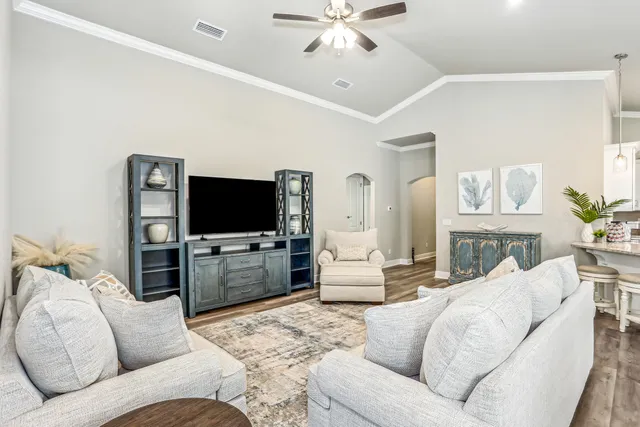 a living room with furniture and a flat screen tv
