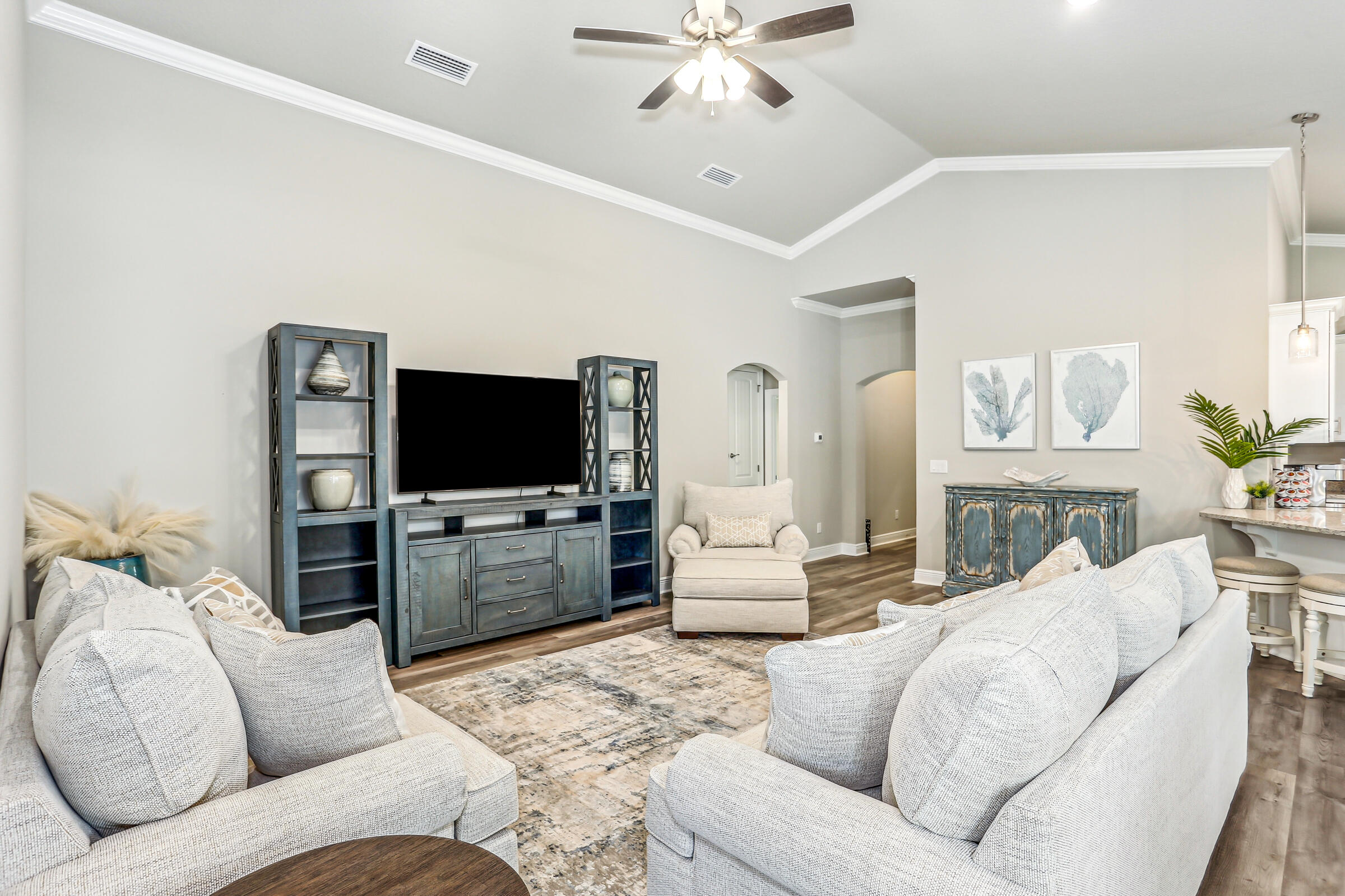 3494 Doyle Hawkins Road Navarre, FL 32566 - Photo 9 of 31 a living room with furniture and a flat screen tv