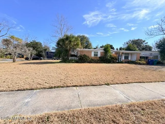 a view of large house with a yard