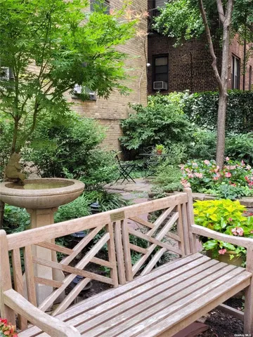 a view of a backyard with sitting area