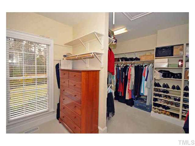 7108 Rippling Stone Lane Raleigh, NC 27612 - Photo 13 of 25 This is only one section of the master closet with lots of custom built ins!