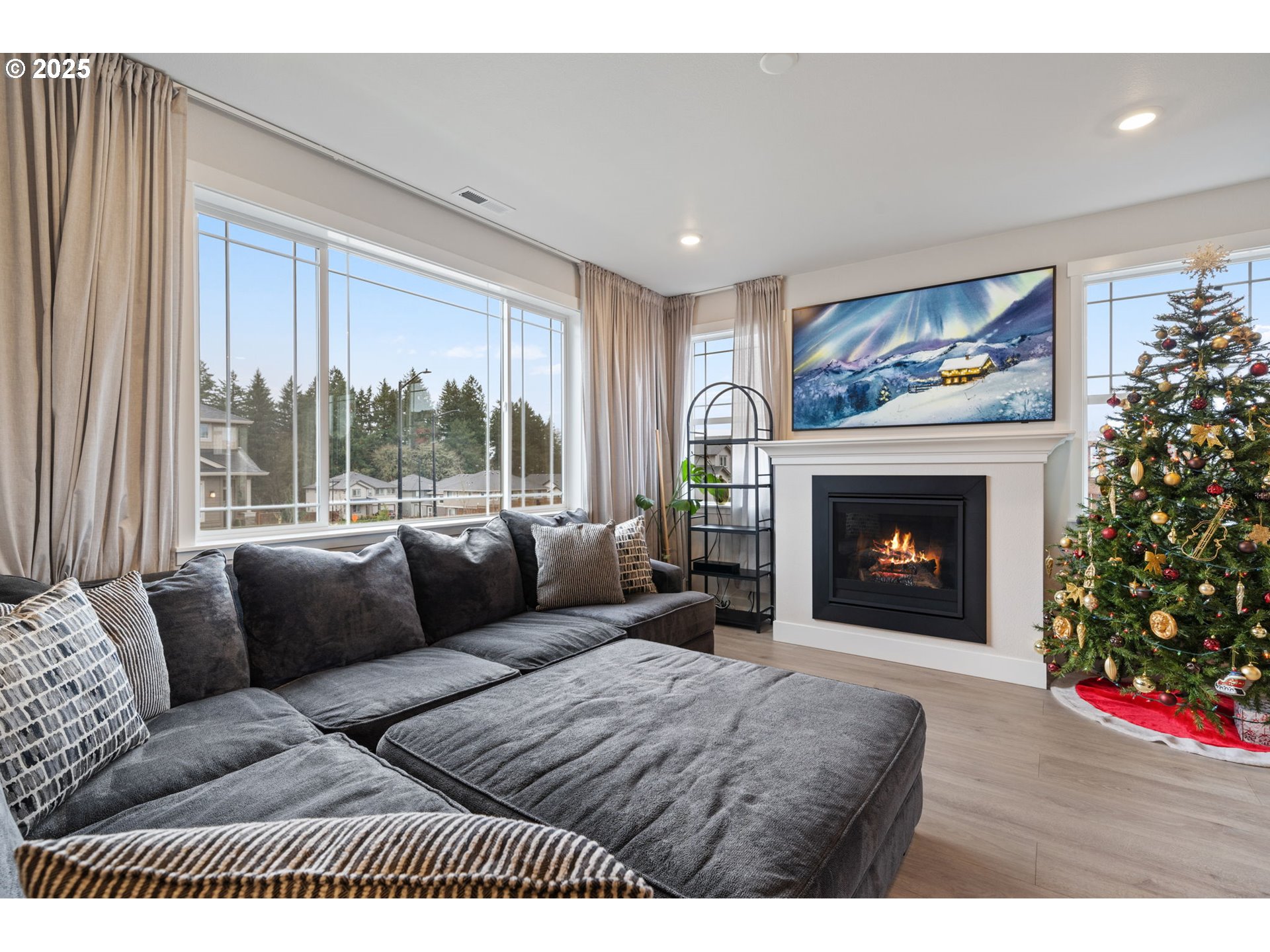 16719 Southwest Beemer Lane Portland, OR 97224 - Photo 13 of 47 a living room with furniture and a fireplace