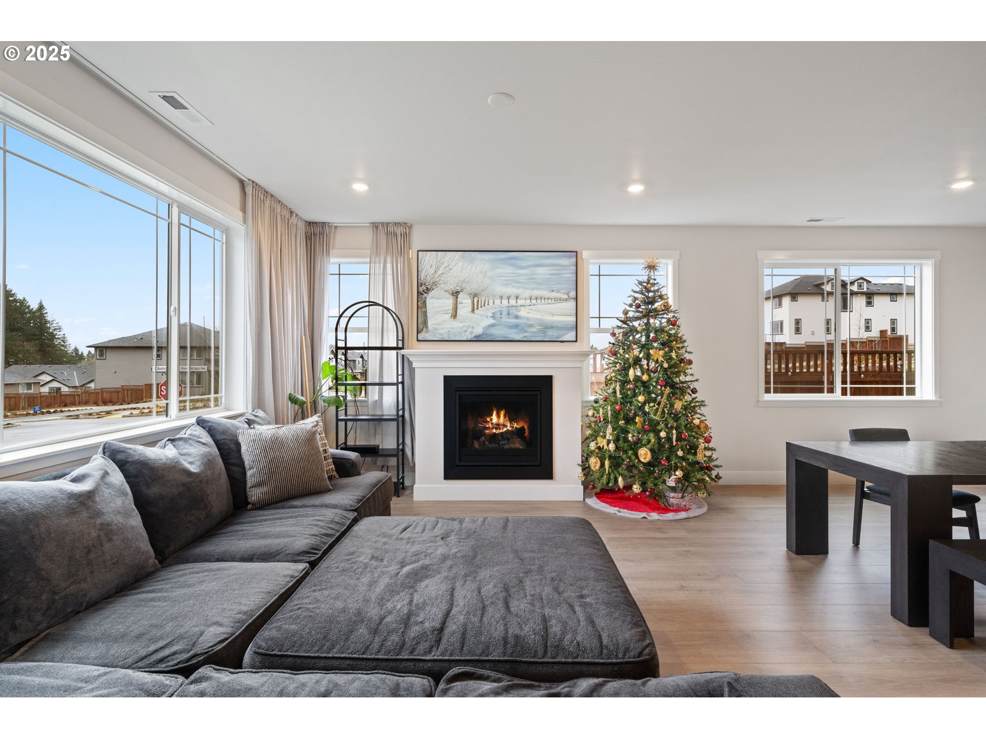 16719 Southwest Beemer Lane Portland, OR 97224 - Photo 14 of 47 a living room with furniture a fireplace and a large window