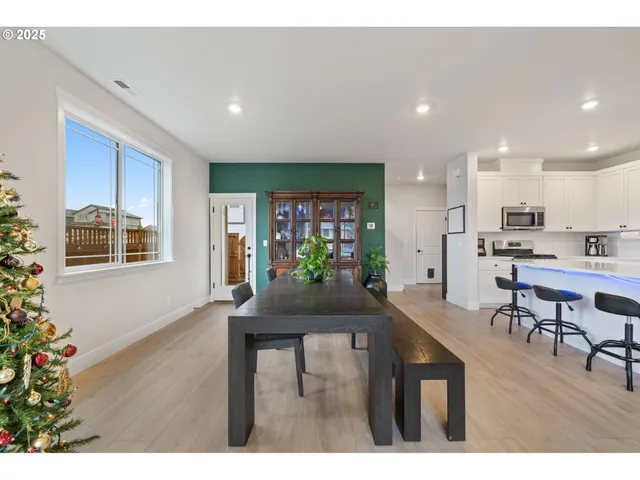 a kitchen with a table and chairs in it