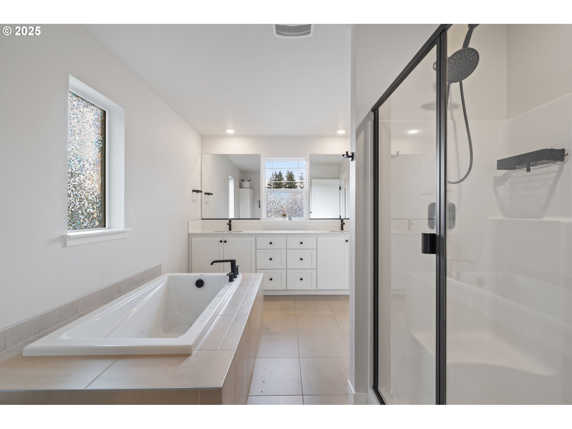 16719 Southwest Beemer Lane Portland, OR 97224 - Photo 23 of 47 a bathroom with a bathtub sink a mirror and a shower